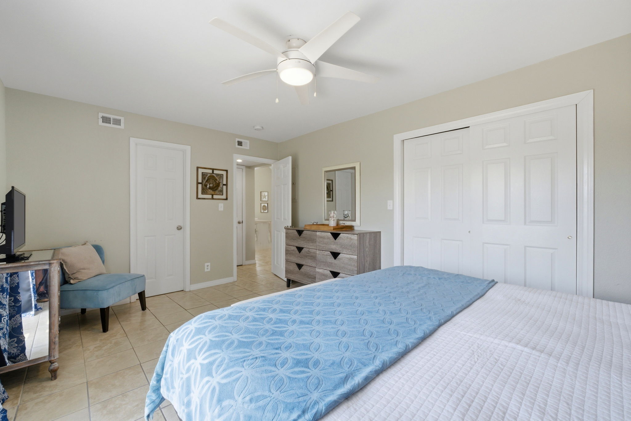 Primary bedroom looking toward bath and living room at Beach Blessings