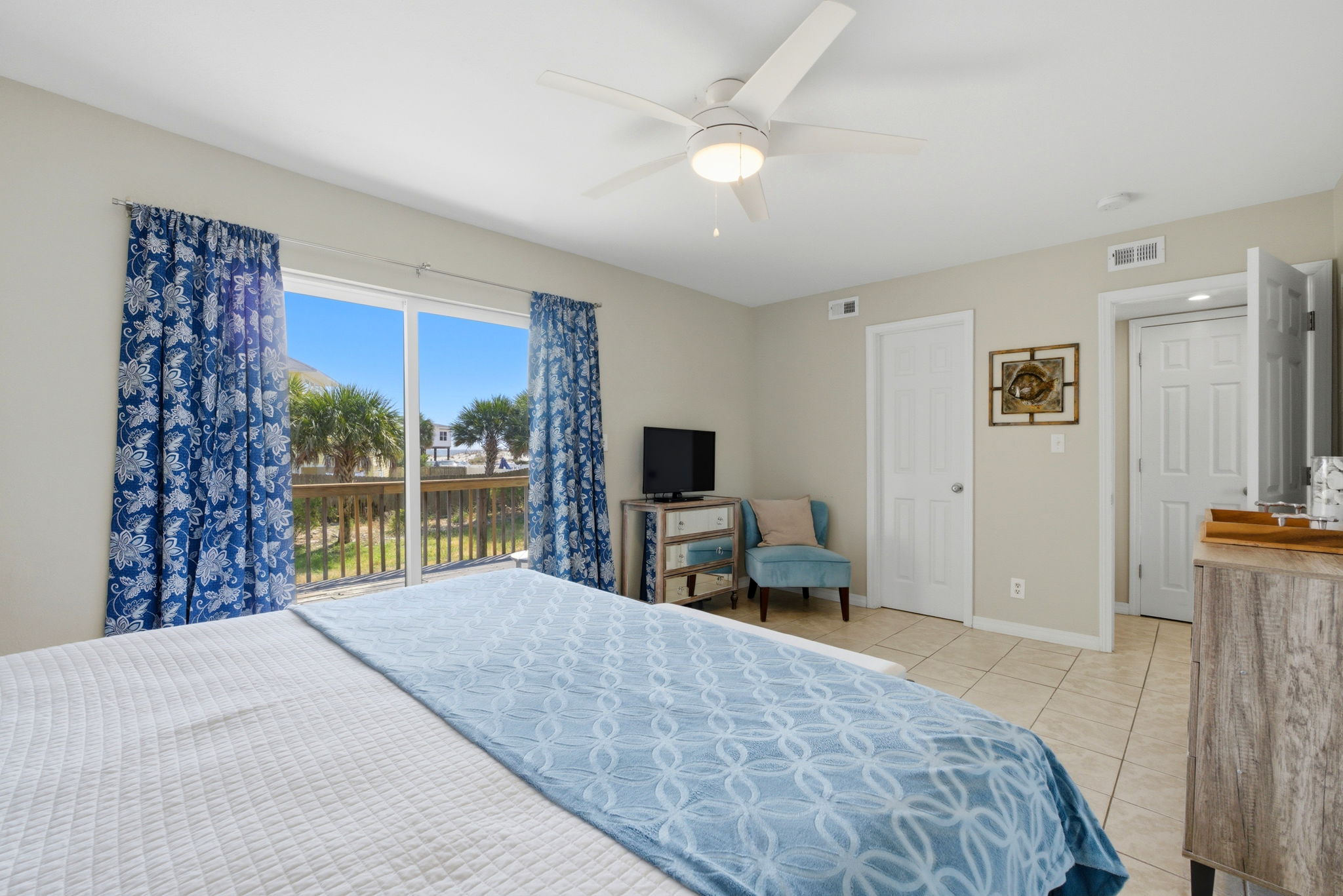Primary bedroom with balcony at Beach Blessings