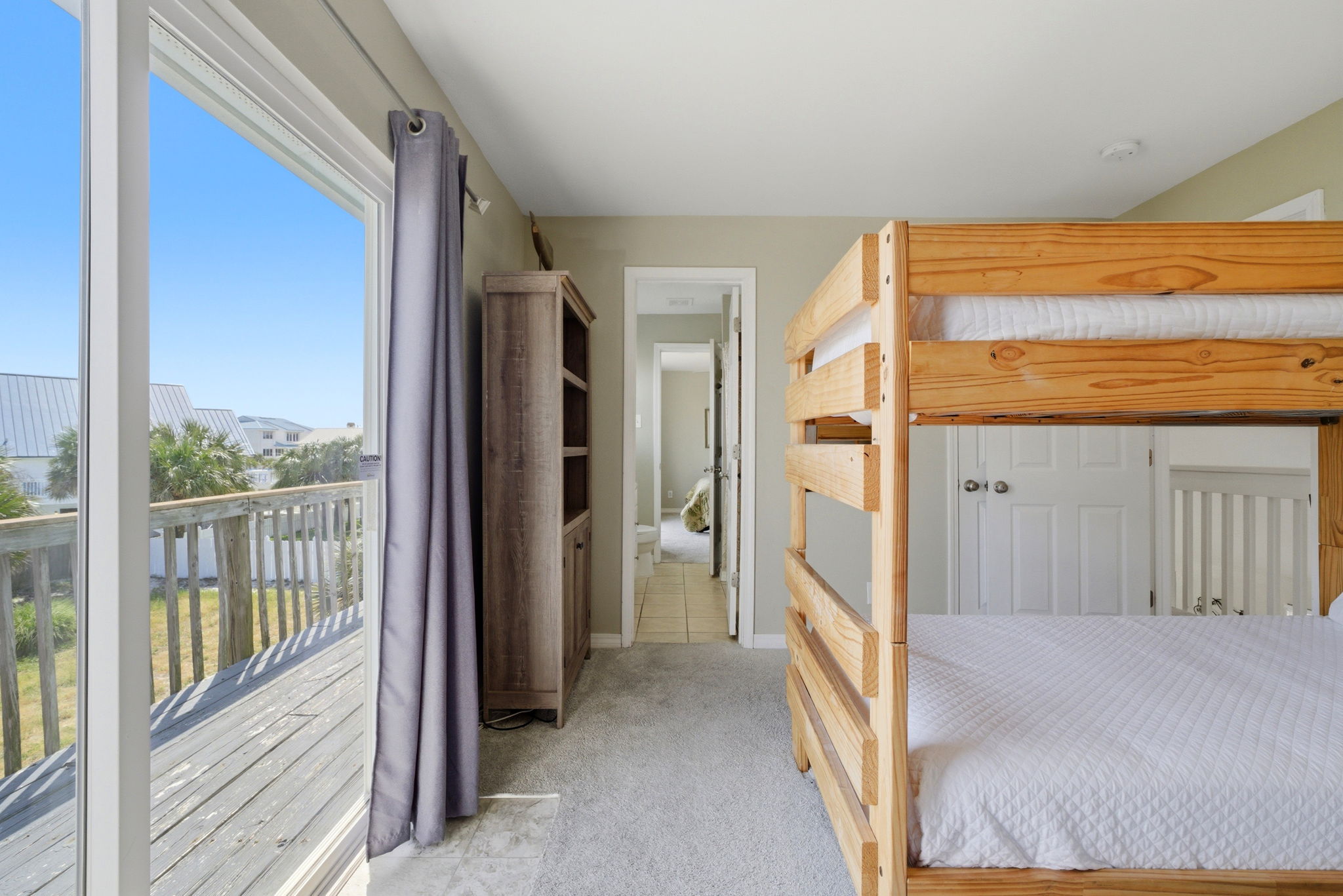 Bunk room with upper balcony at Beach Blessings