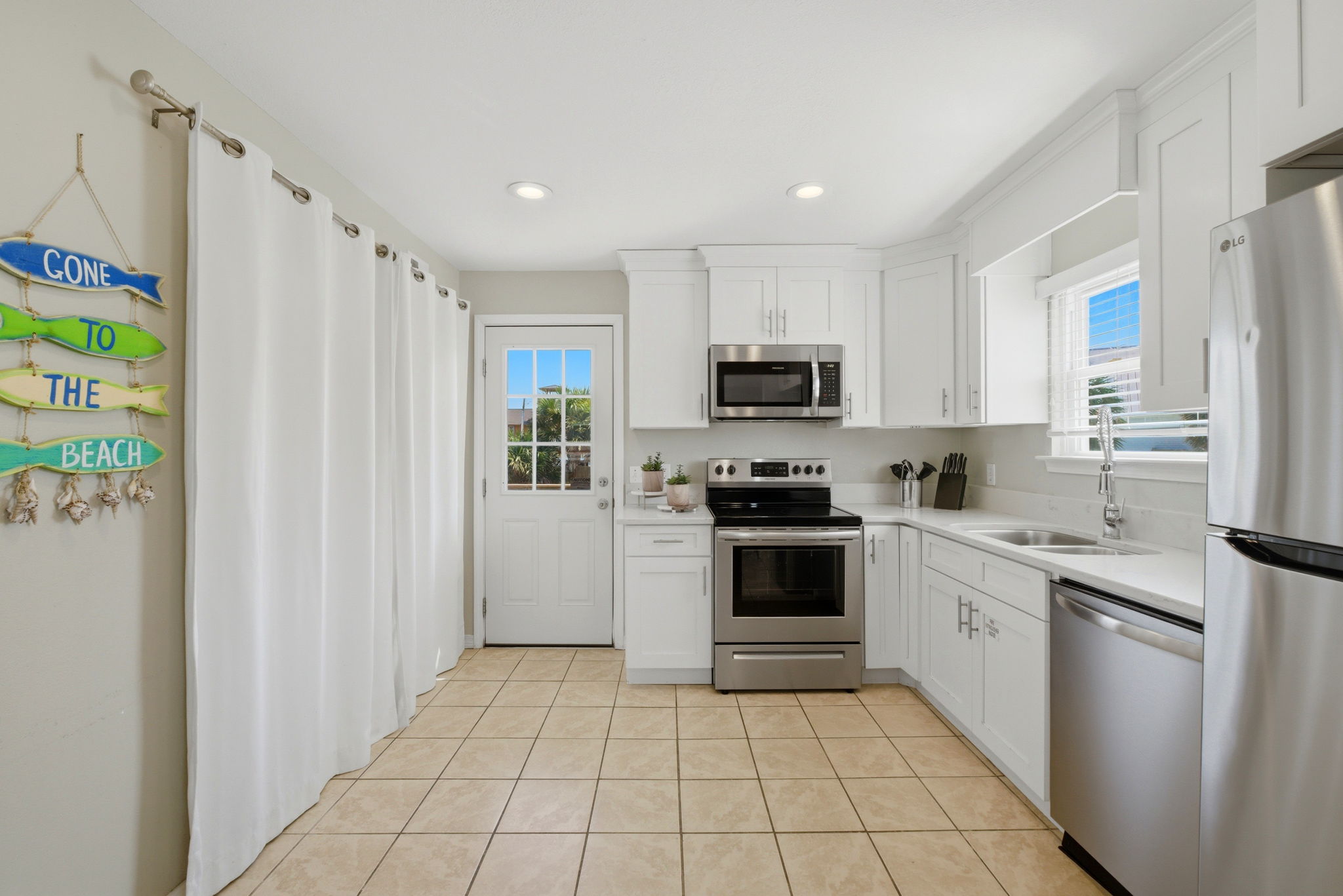 Kitchen with laundry area at Beach Blessings
