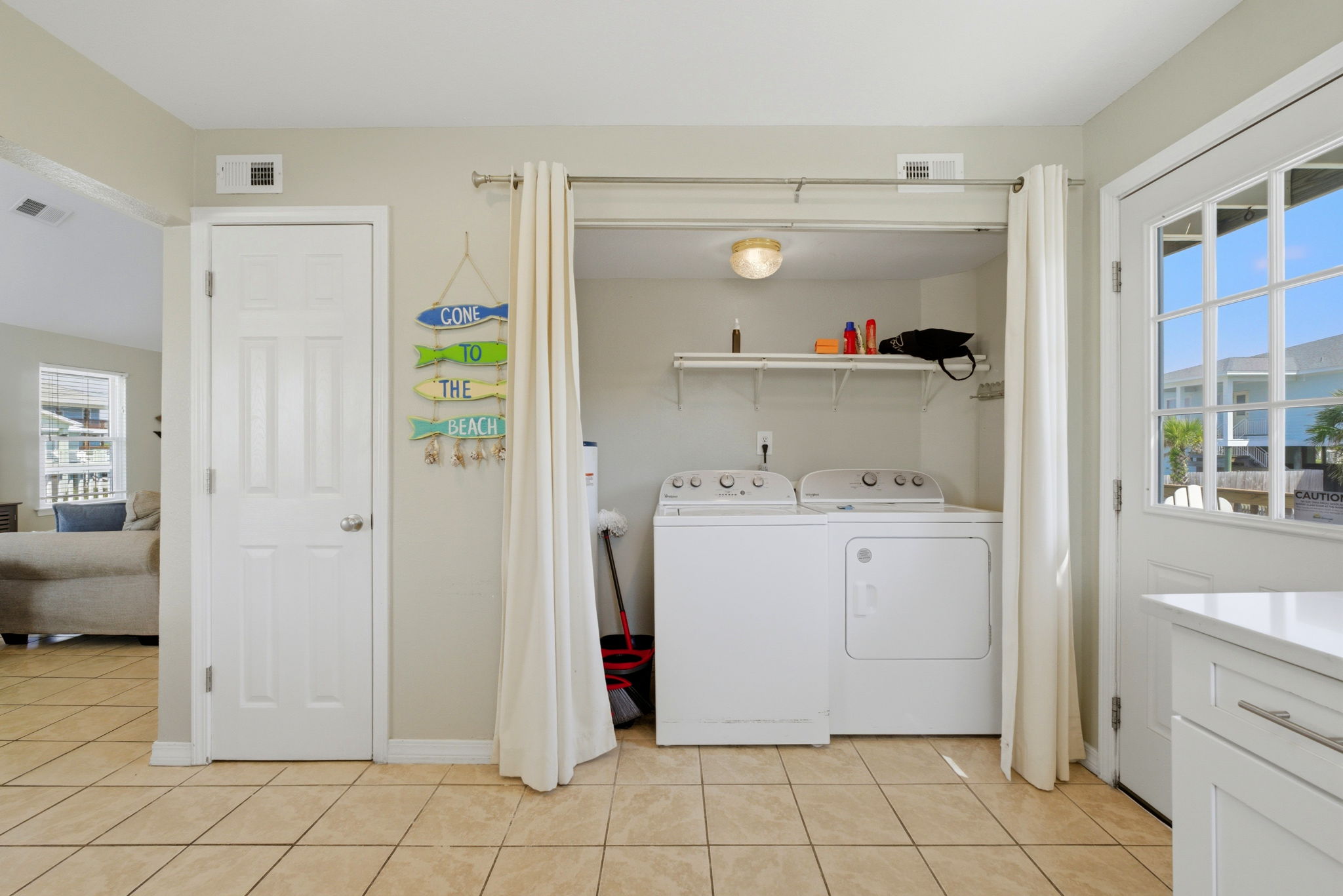 Laundry area attached to the kitchen at Beach Blessings